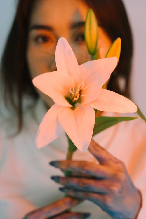 Woman Holding Easter Lily