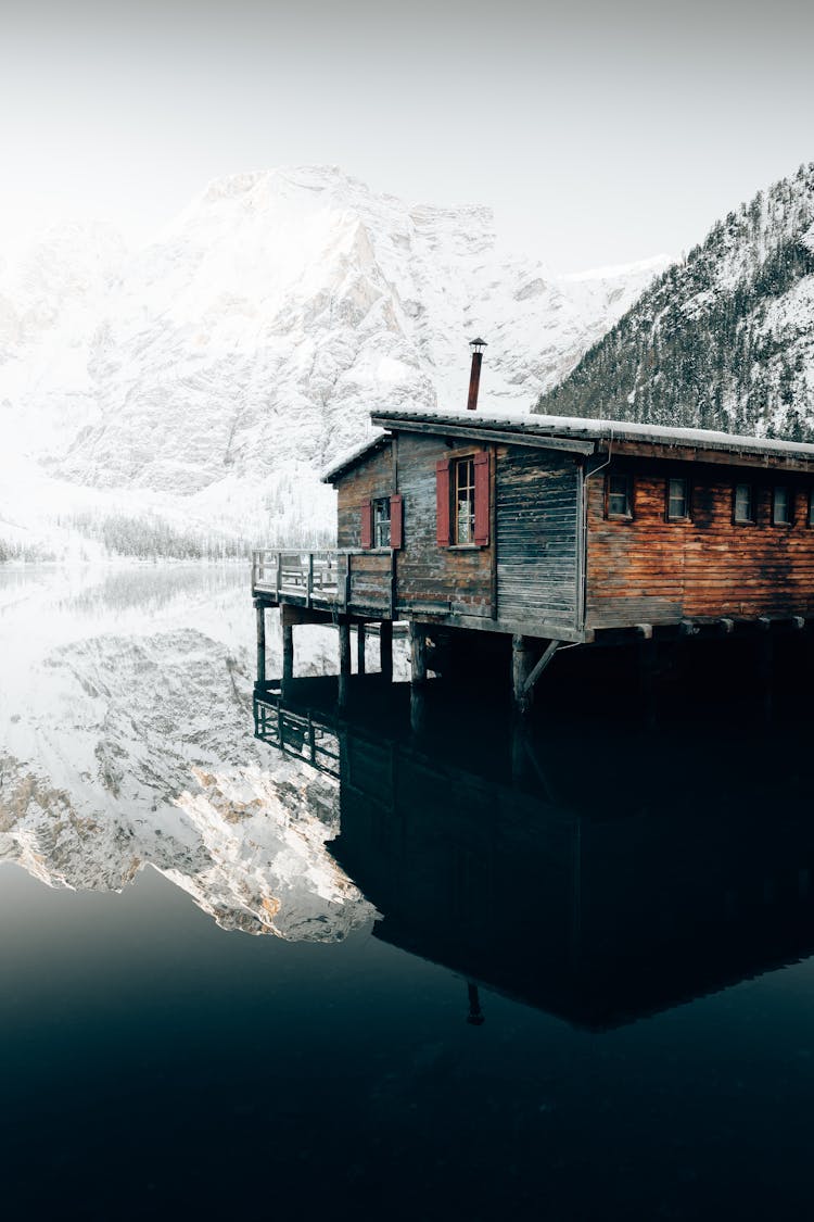 A Wooden House Over A Lake