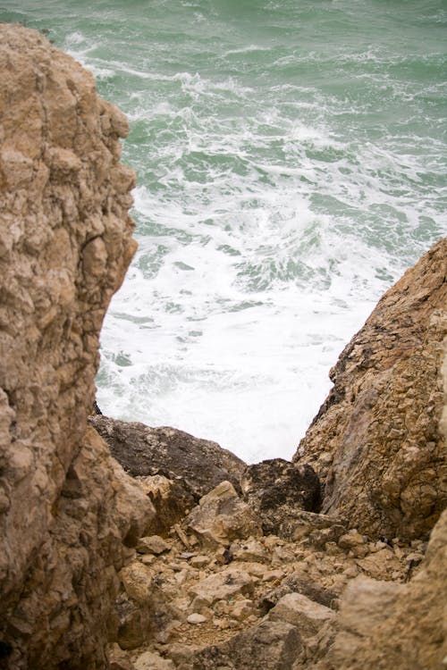 Photo of the Sea Between the Cliffs