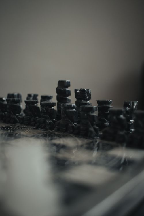 Free An artistic shot of a blurred chess set emphasizing strategy and leisure activities. Stock Photo
