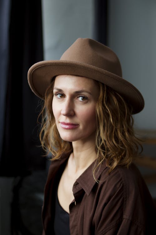 Photo of a Pretty Woman in a Brown Hat
