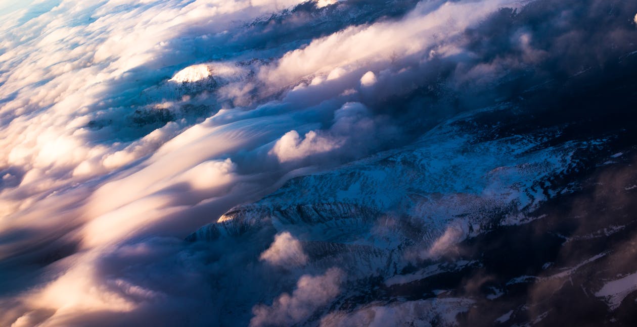 Free Aerial Photography of White Clouds over Mountain Stock Photo