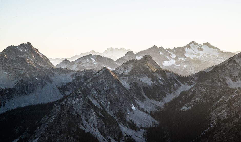 Snow-covered mountain range at dawn