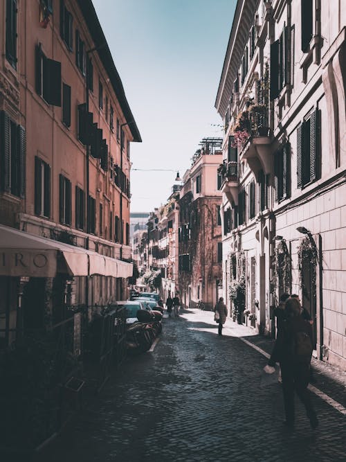 Traditional Italian Alley between Buildings and Restaurants 