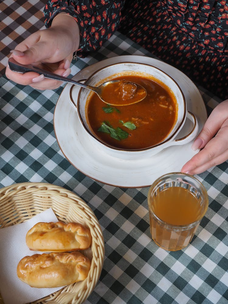 Woman Eating Soup