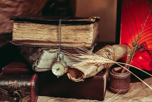 A vintage still life arrangement with old books, a pocket watch, and a rustic setting.