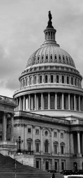 Black and white photo capturing the iconic dome of the United States Capitol in Washington, DC.