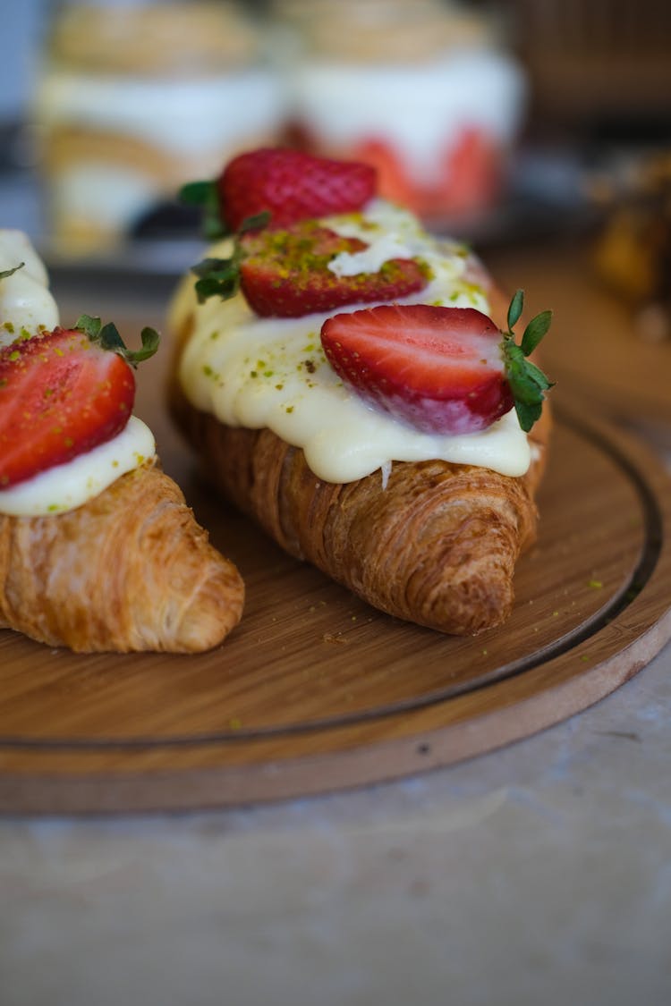 Close-up Photo Of A Delicious Croissant With Sliced Strawberries 