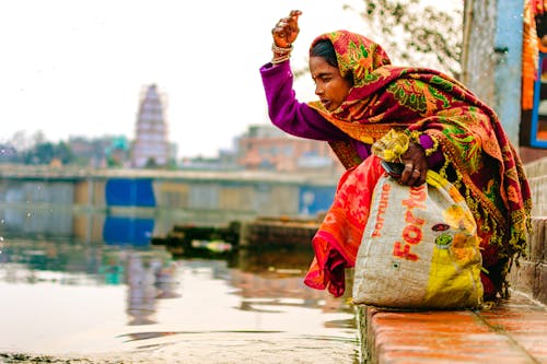 Woman Sprinkling Herself with Water from the Ganges River