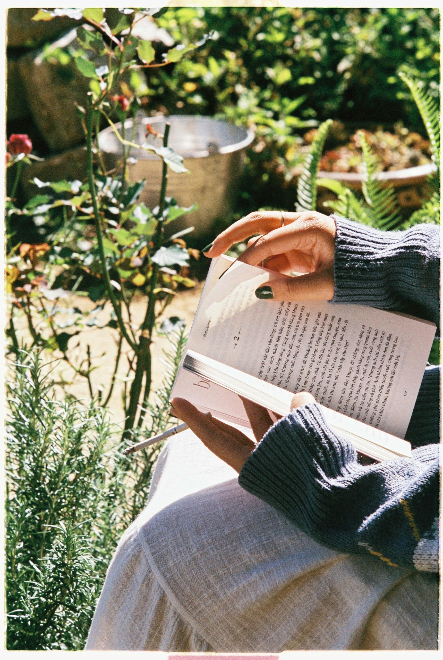 Empty book in the hands of a gardener Stock Photo