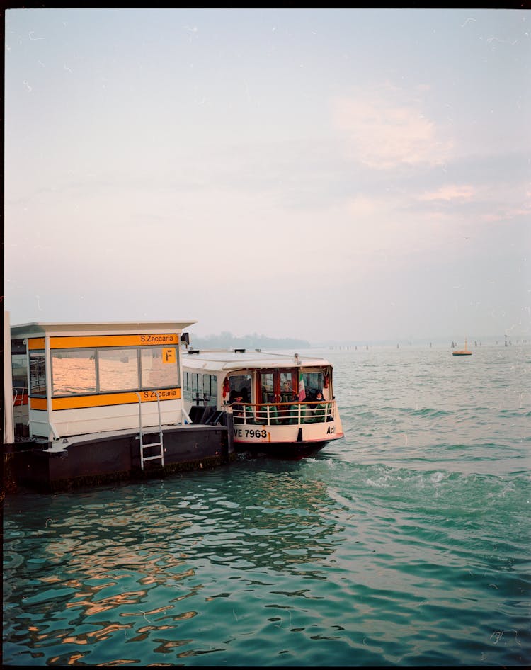 Water Taxi Docked On A Station