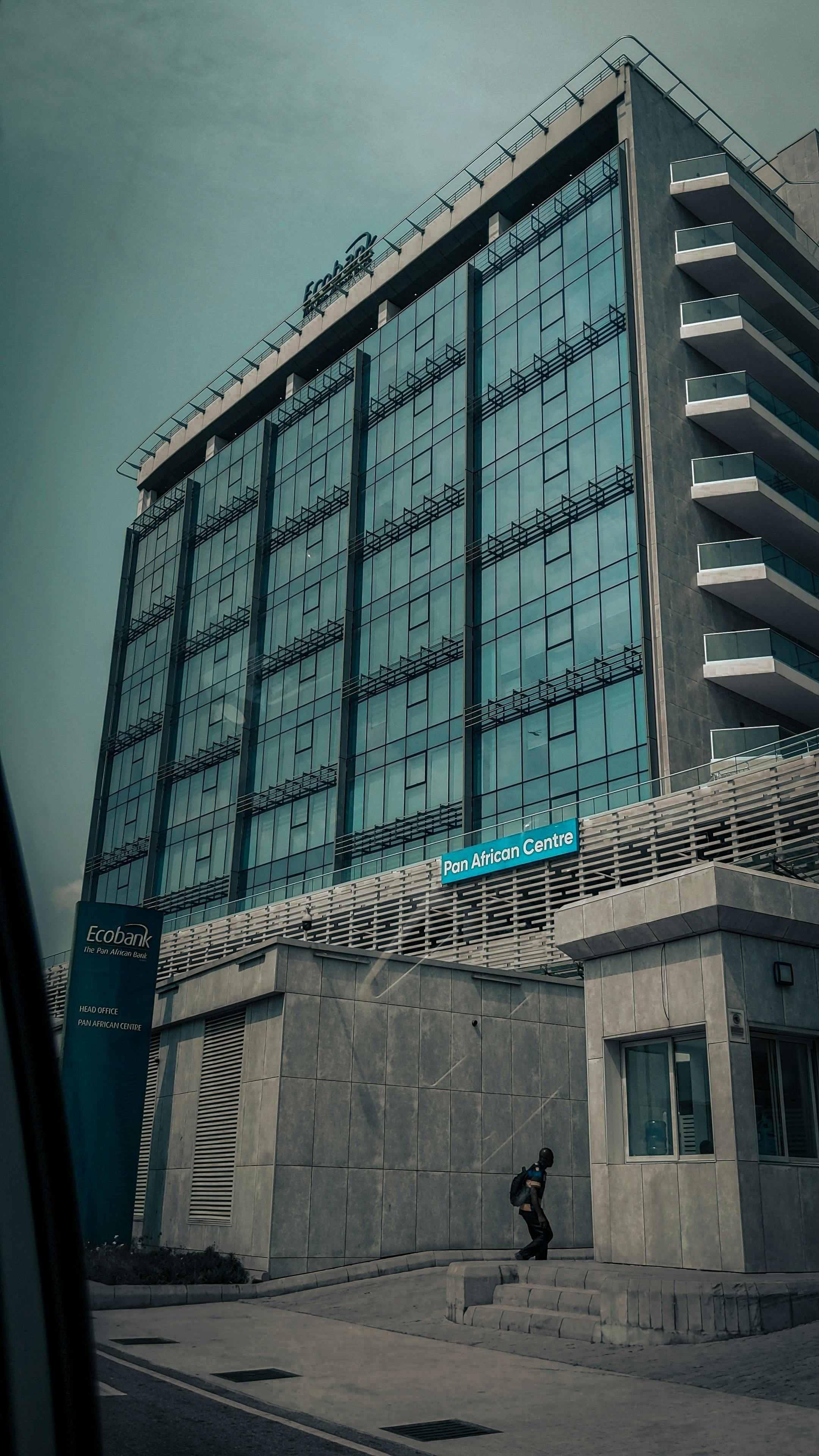Urban office building with glass facade in Lagos, capturing modern architecture and city life.