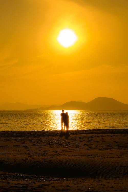 Couple Together on Beach at Sunset