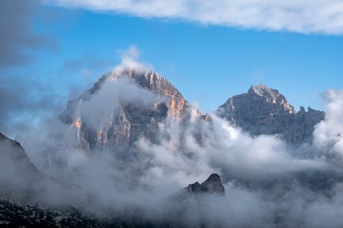 Free Breathtaking view of the Tofane peaks shrouded in clouds in the Dolomites, Cortina d'Ampezzo, Italy. Stock Photo
