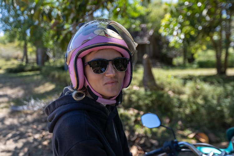 Portrait Of A Woman With A Pink Helmet