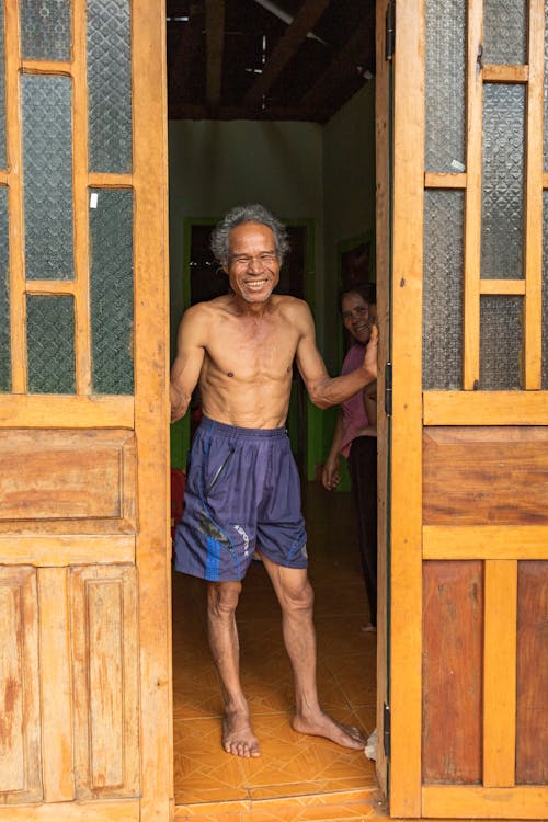 Smiling Topless Man in Door