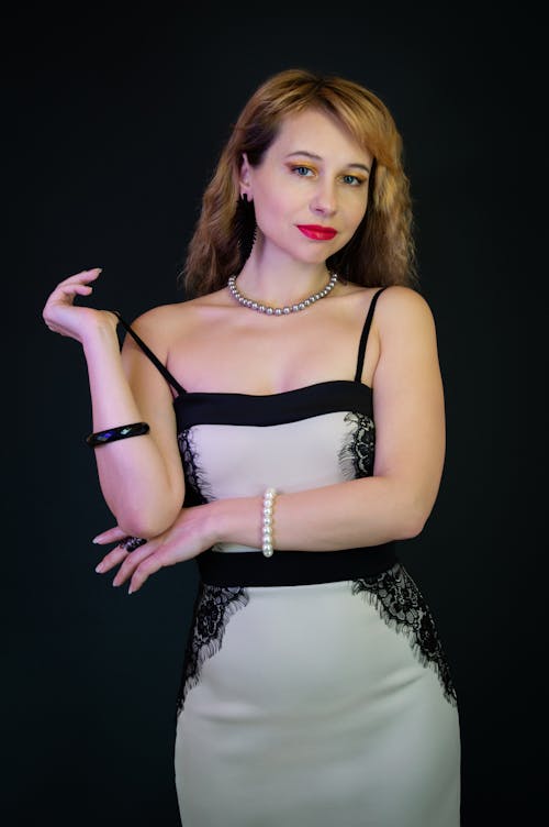 Young Woman Posing in an Elegant Dress