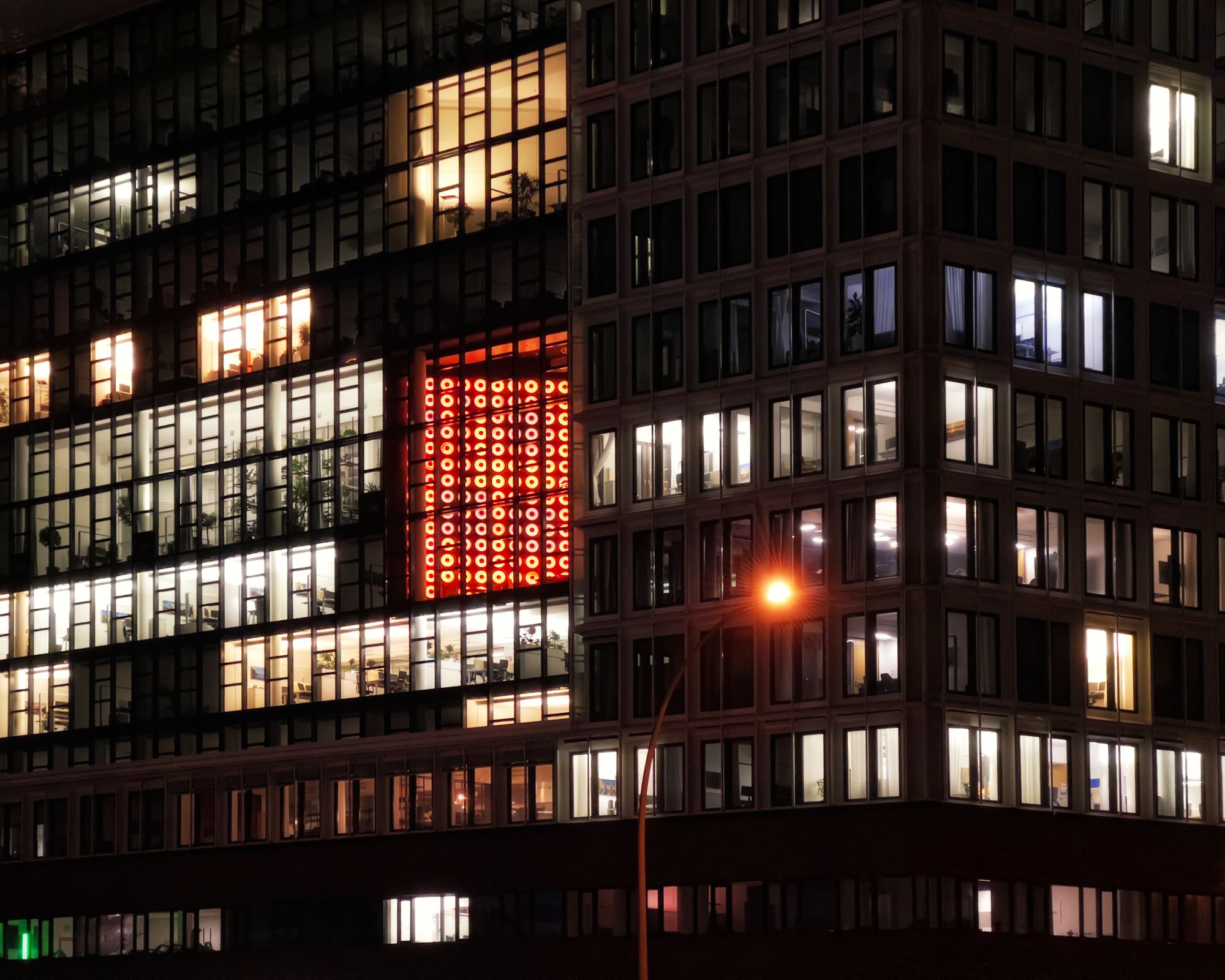 A dark, moody office workspace matching Clockwise's dark-mode aesthetic