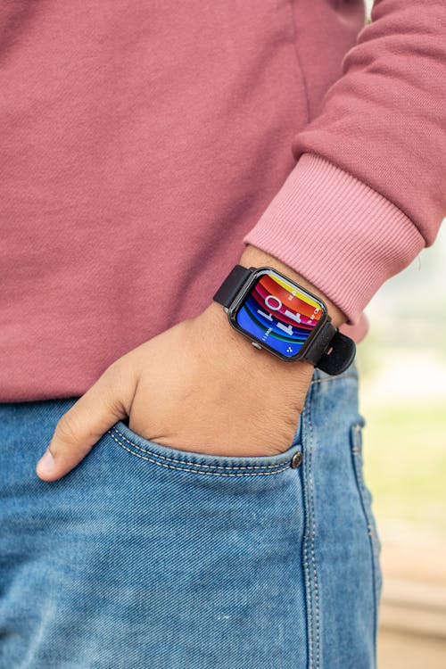 Close-up of Man Wearing a Smartwatch Holding His Hand in Pocket 