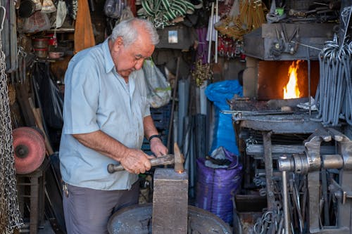 A Man Forging Metal