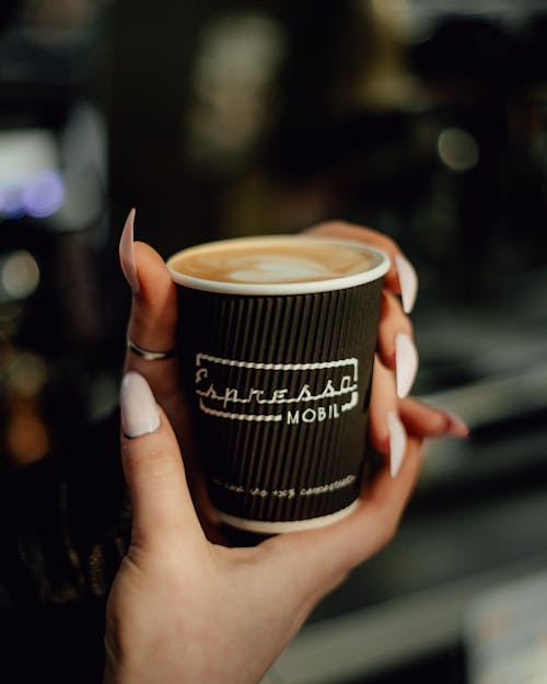 Coffee Cup in Woman Hands