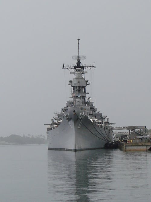 Military Vessel Moored on Shore