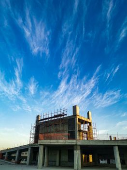 Captivating view of a modern building under construction with a clear blue sky overhead.
