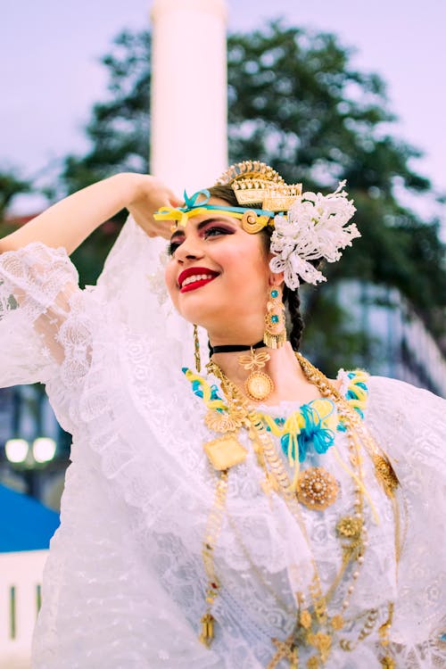 Young Woman in a Traditional Dress Dancing during a Celebration 