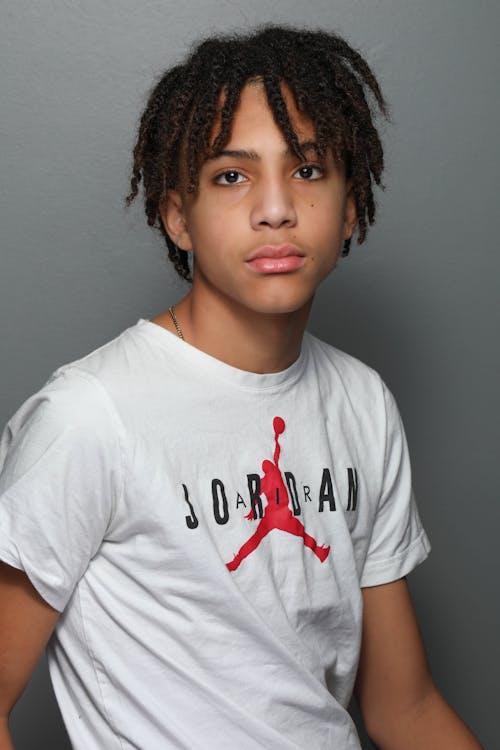 Man with Dreadlocks Wearing White Crew Neck T-Shirt 