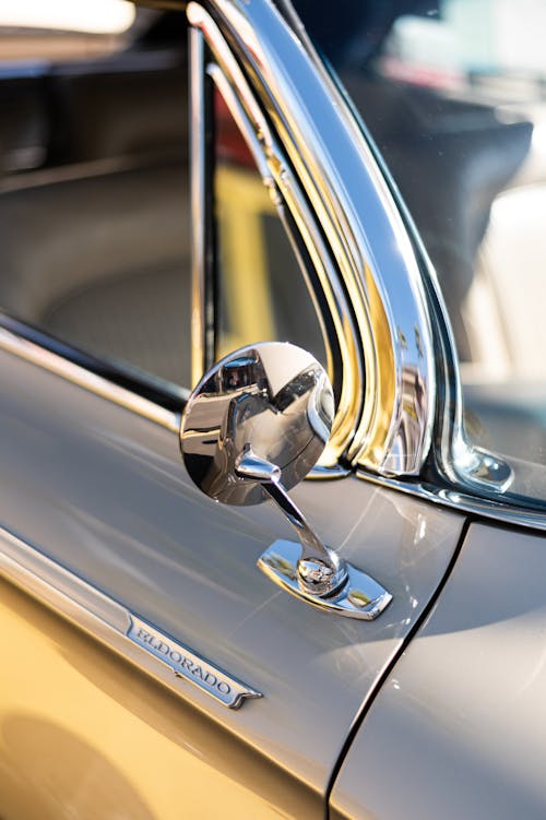 Close-up of a Side View Mirror in a Vintage Car 