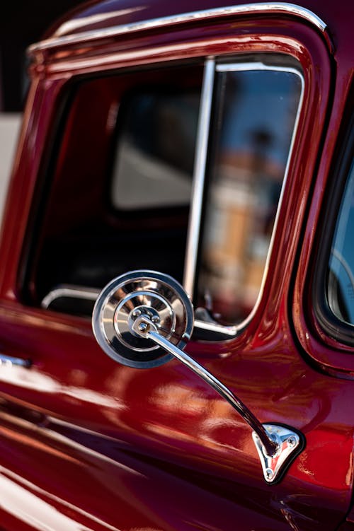 Close-up of a Side View Mirror in a Vintage Car 