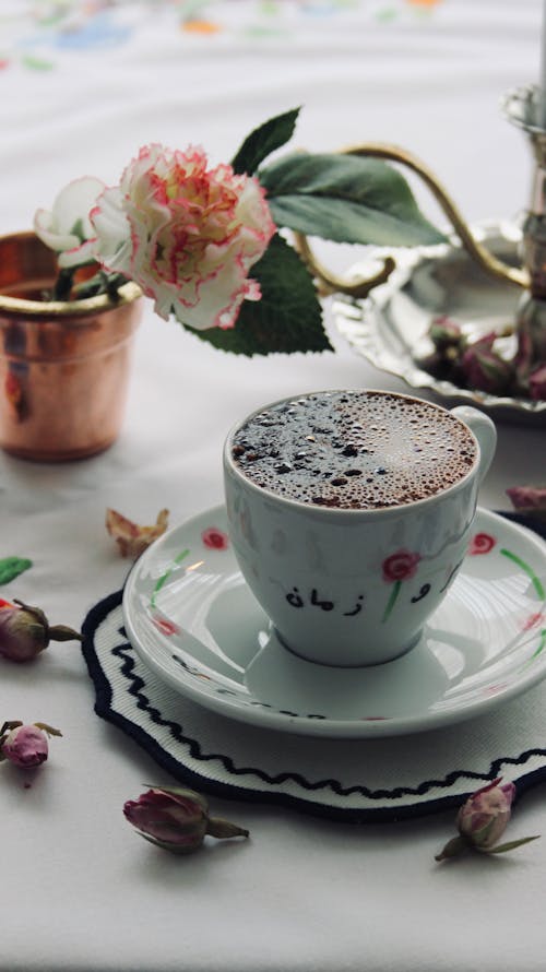 Free Cup of Black Coffee, Flower and Pot on Table Stock Photo