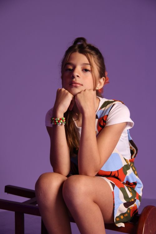 A Fashionable Girl Posing In Studio On Purple Background Free Stock Photo a-fashionable-girl-posing-in-studio-on-purple-background-free-stock-photo