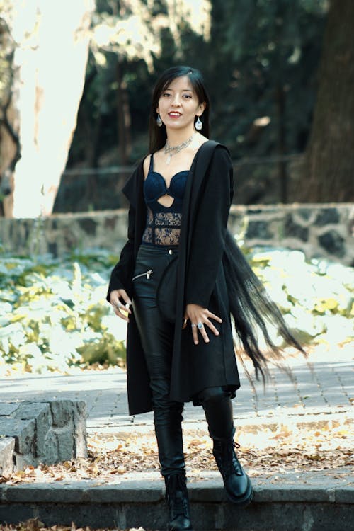 necklace
jewelries
Woman in Black Coat Standing on Concrete Steps
