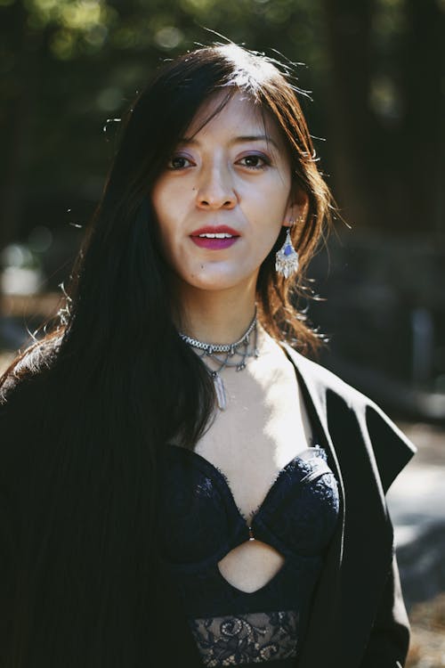 Brunette Woman with Necklace in Black Top