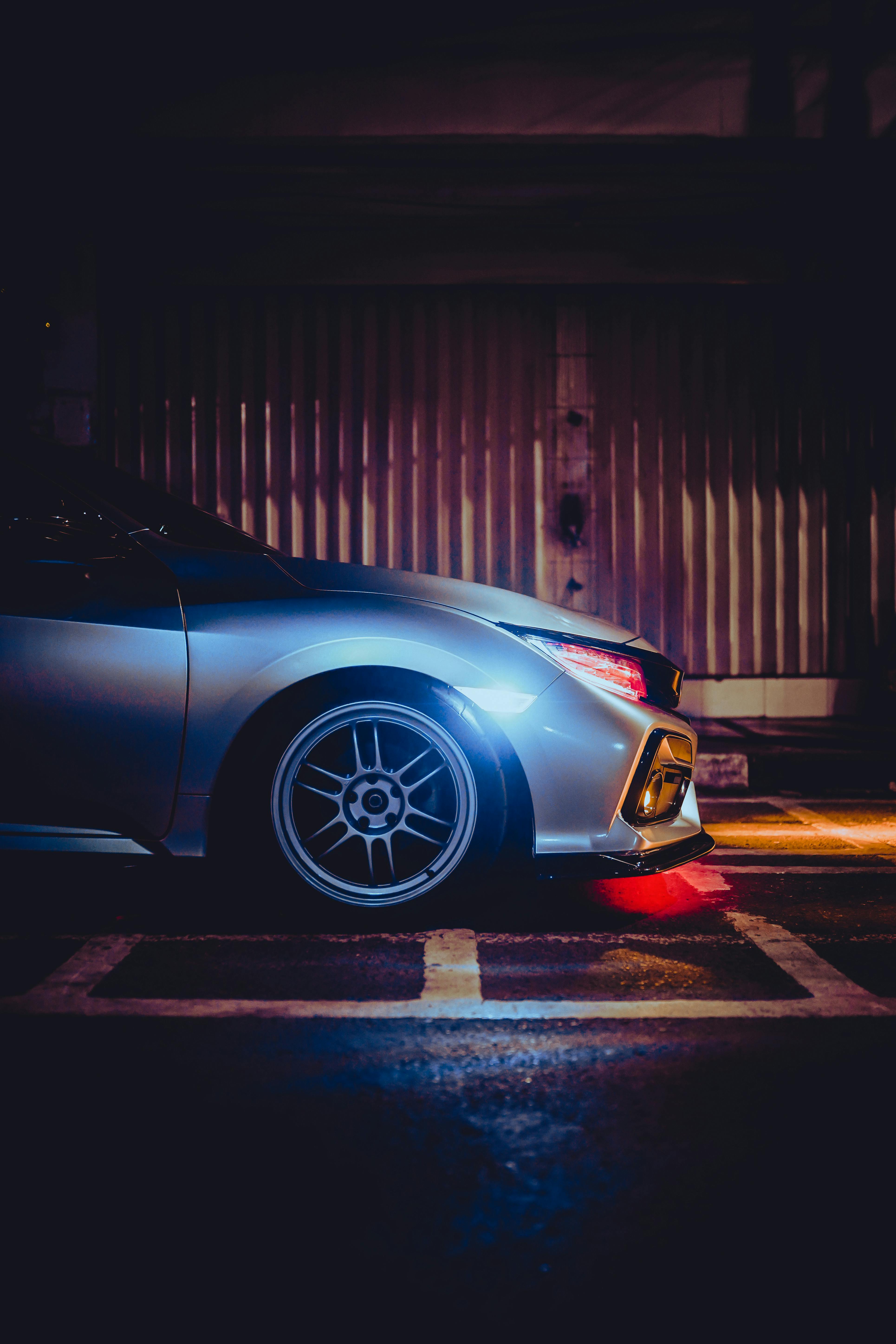 Sports Car Parked in front of a Store · Free Stock Photo