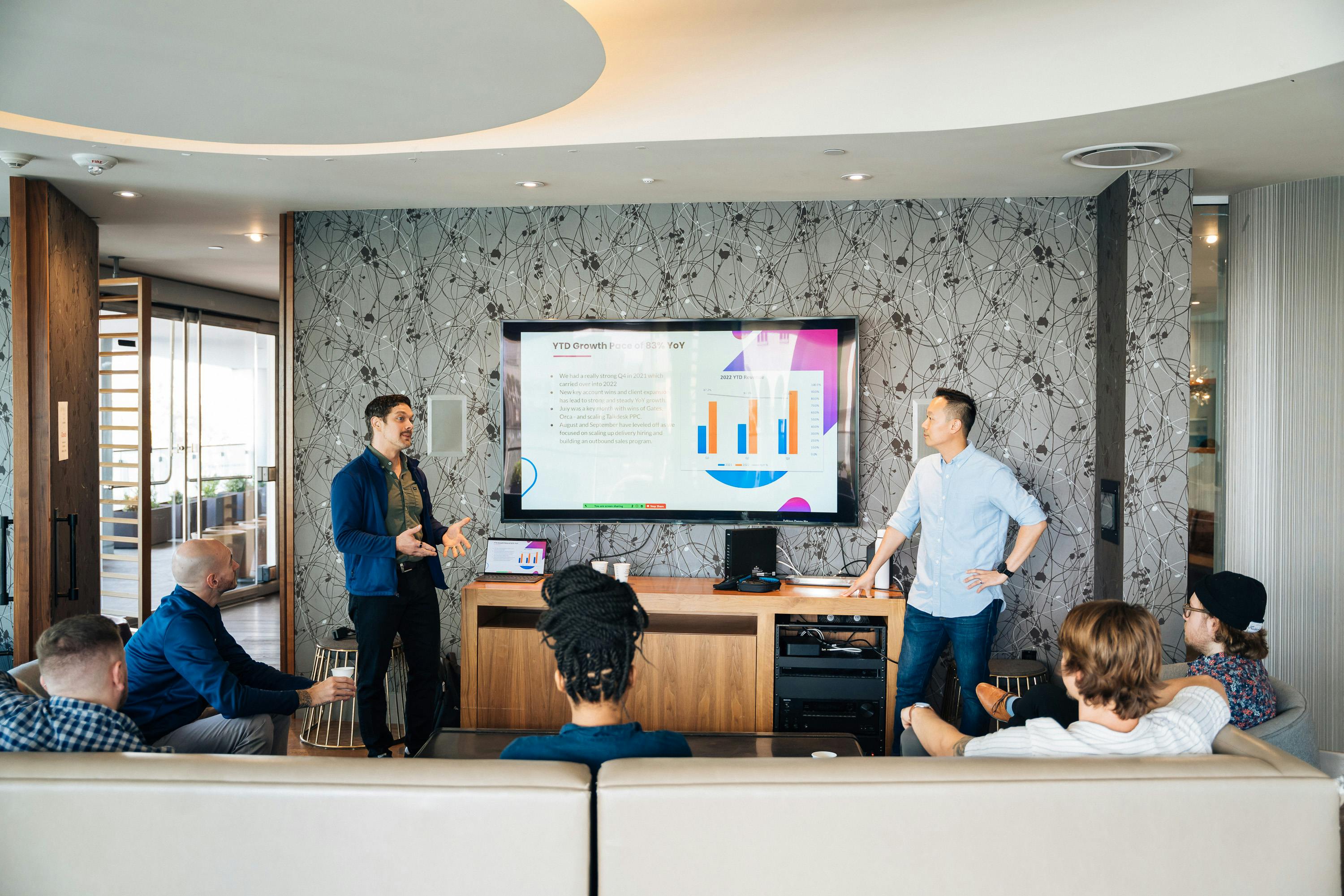 Business professional standing near modular display stand setup in Ahmedabad exhibition hall