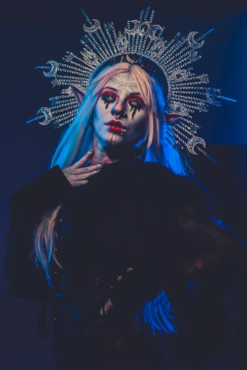 Young Woman in a Halloween Costume with a Crown