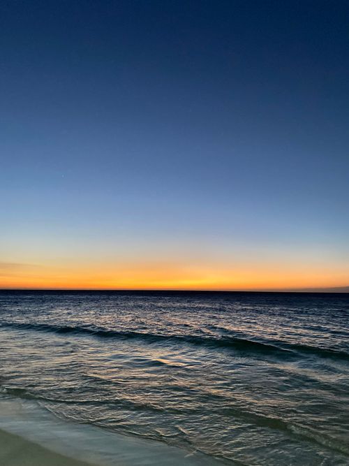 Free Tranquil sunset over the ocean at Santa Marta, Colombia. Perfect for travel inspiration. Stock Photo
