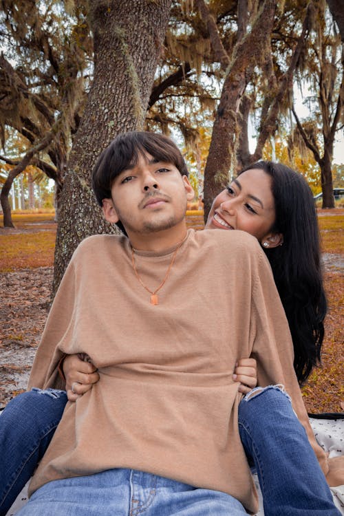 A Couple Sitting in a Park