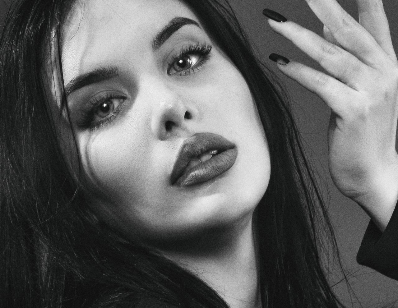 close up black and white portrait of a woman with expressive eyes and