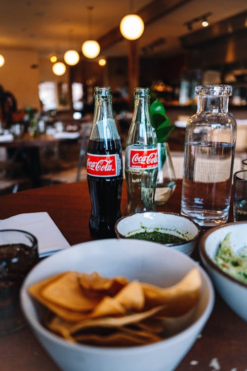 Chips and Coca Cola on Table