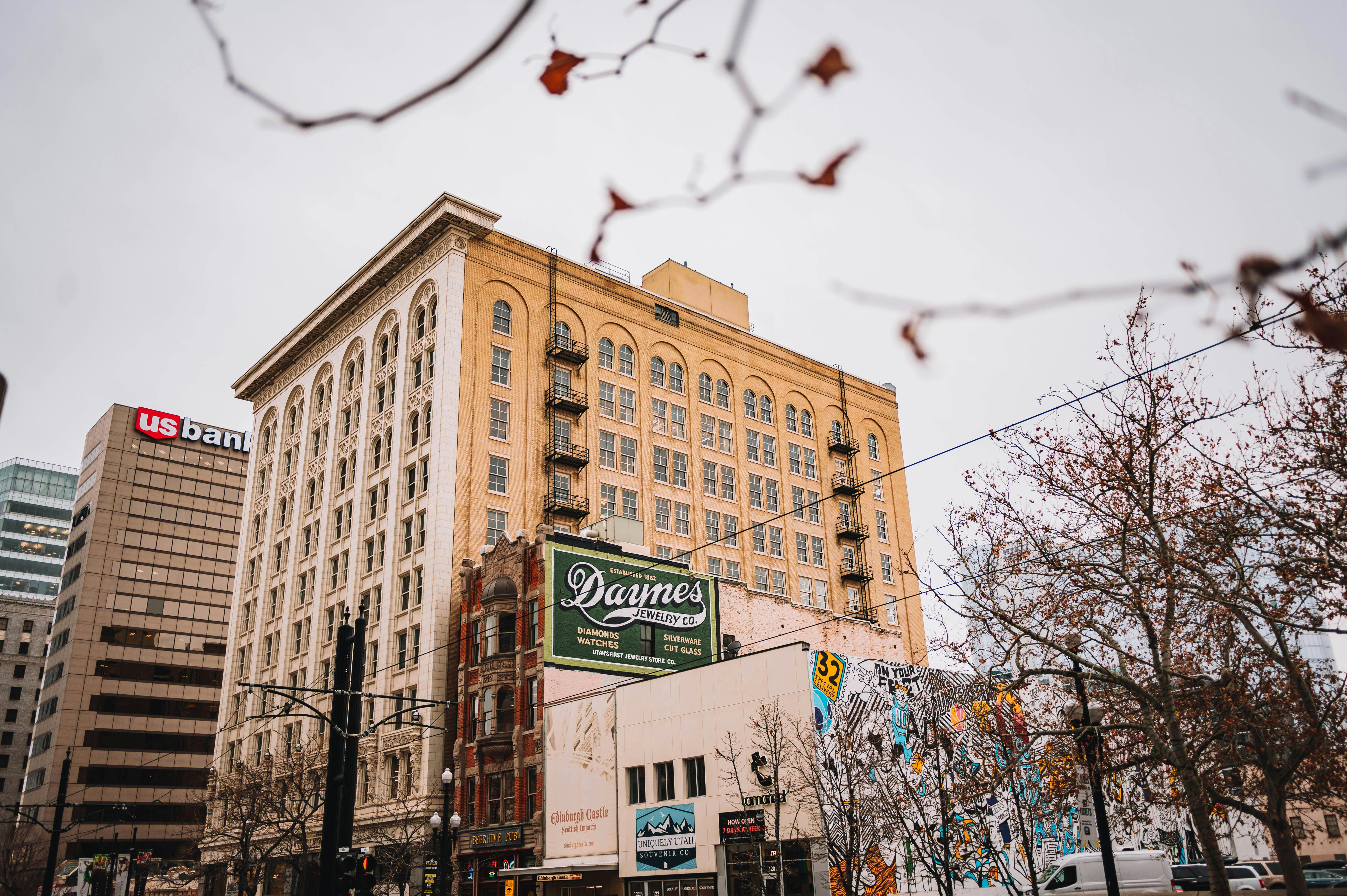 Captivating view of historic downtown buildings in an urban setting, with autumn trees framing the scene.