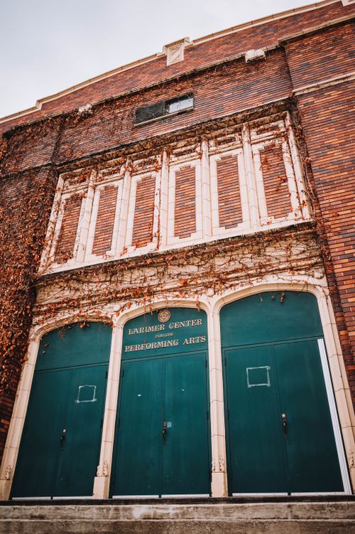 Free Vintage facade of Larimer Center for Performing Arts with brick and ivy exterior. Stock Photo