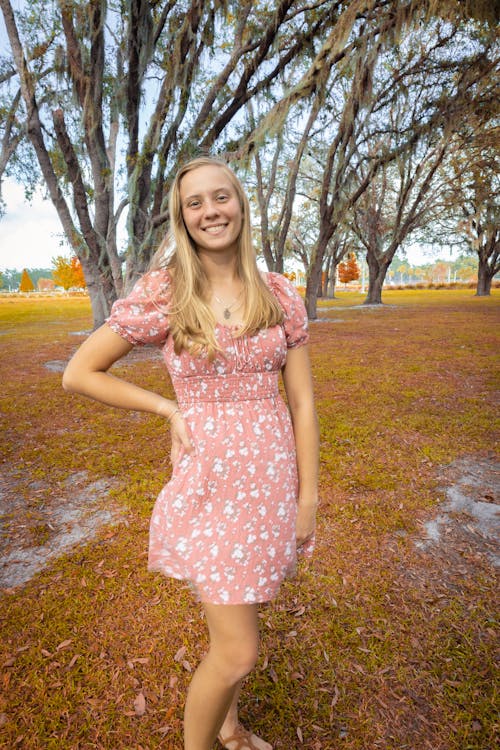 Smiling Blonde Woman in Sundress
