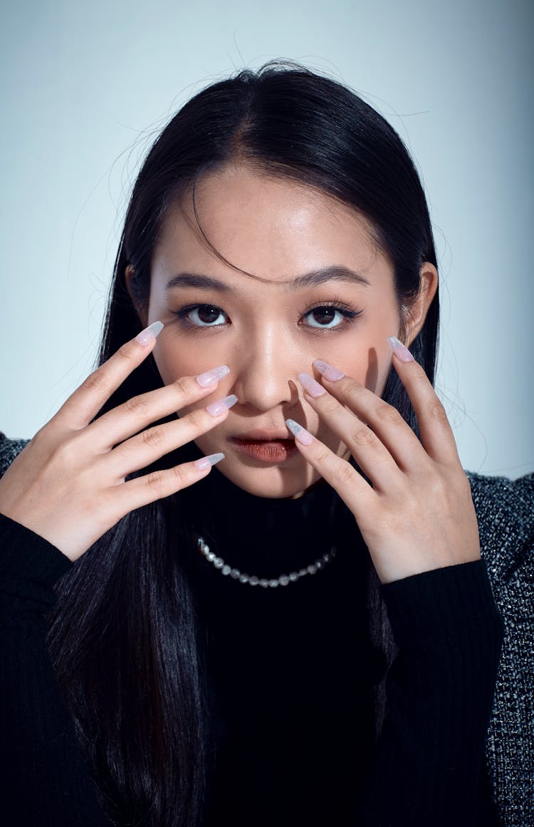 Woman Face And Hands With Manicure