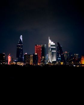 Stunning night view of a city's illuminated skyline with modern skyscrapers.