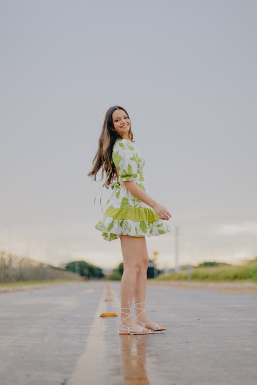 Woman Posing on Wet Road