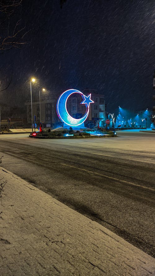Illuminated Crescent in Town in Winter at Night
