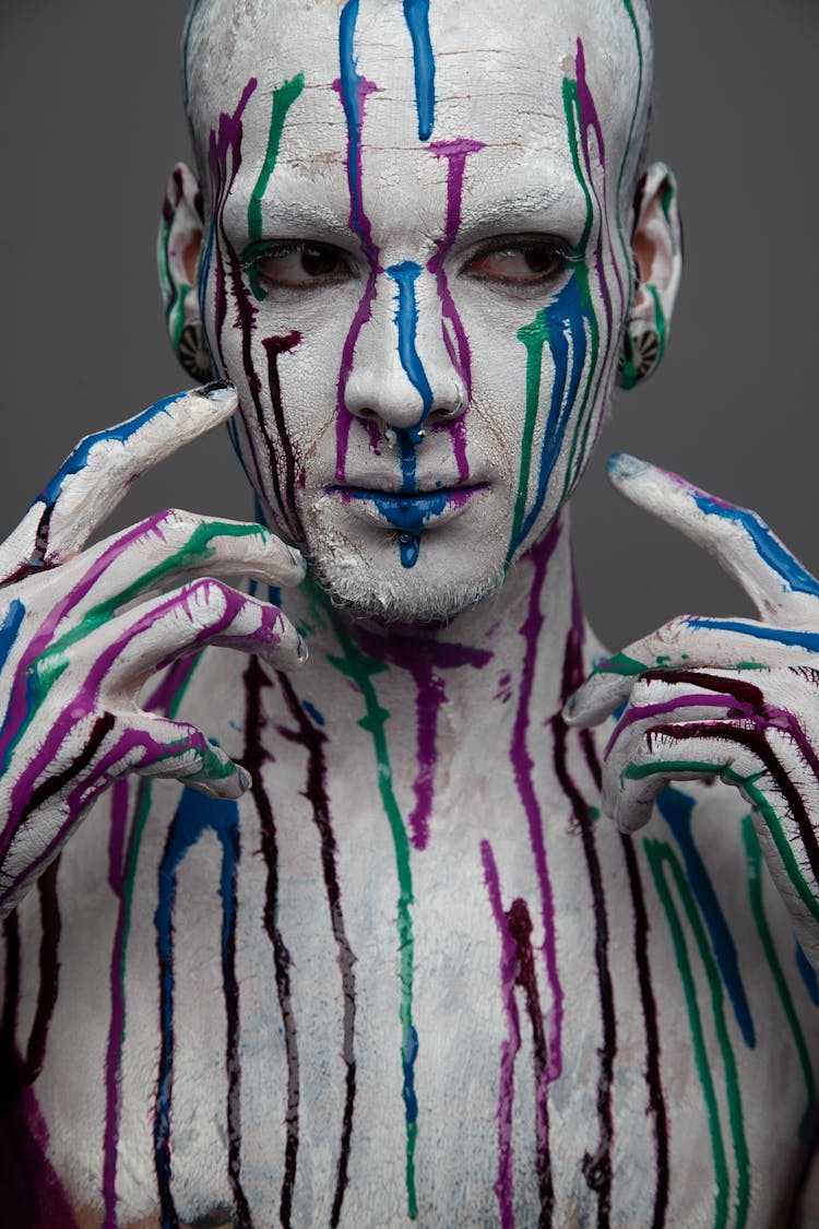 A Man Covered In Paint